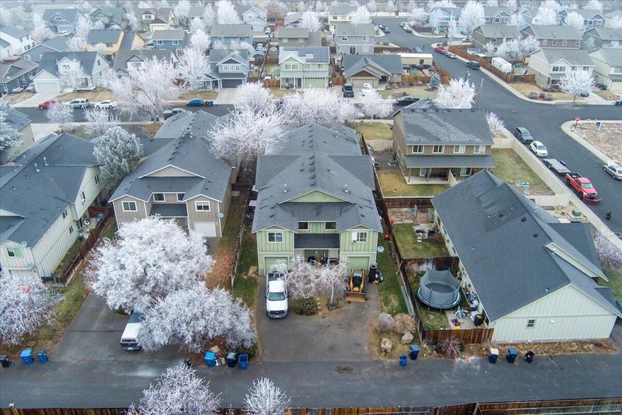 This fully leased 4-plex in SW Redmond offers a great investment opportunity. Each of the four units features approximately 1,400 square feet. The main level showcases an open floor plan that combines the kitchen, family room with a cozy gas fireplace, dining area, and half bath. The kitchens are equipped with gas cooktops. Upstairs, each unit features three well-sized bedrooms, including a primary suite with its own en-suite bathroom, as well as an additional full bathroom, a laundry closet, and a linen closet. Attached single-car garages offer secure parking and extra storage. Zoned heating systems ensure comfort and efficiency. Contact us today to learn more or schedule a private showing!