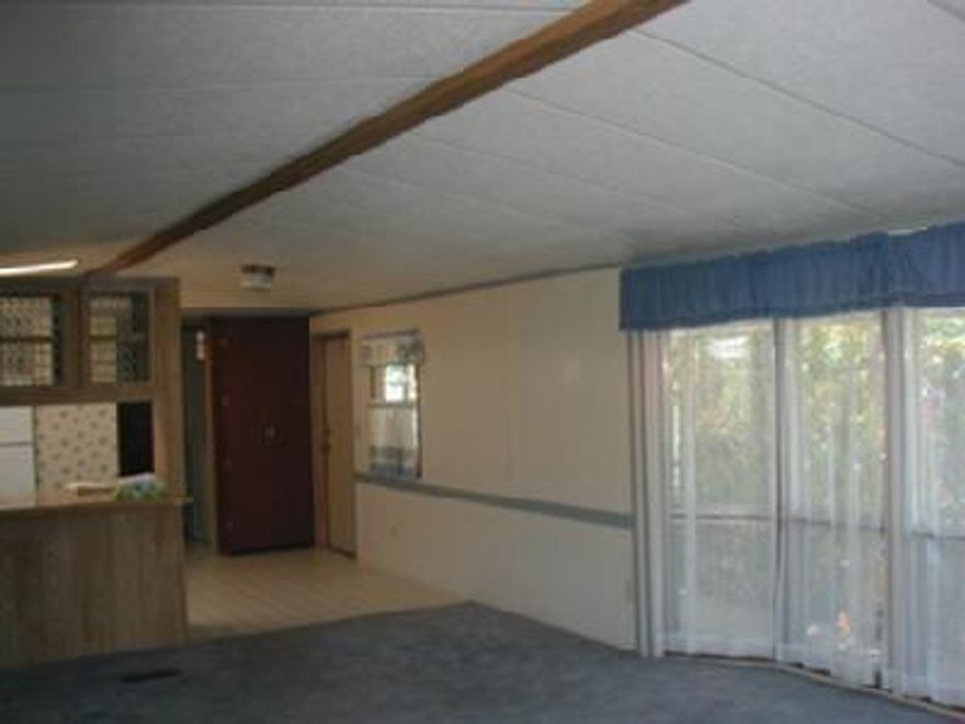 *Deep discount now. Cash sale required. Newer mfd home in clean, quiet 55+ Phoenix park. Vaulted LR, nice floor plan with bedrooms, baths at either end. Small, solid workshop with power - nice, easy care yard with patio, covered porch. Cable available. Oakhurst model. Seller will allow for carpet & some painting & repairs.
