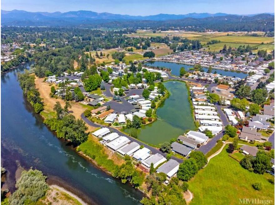 Come live in this beautiful two bedroom, two bath updated home in Roguelea Estates, Grants Pass' premier 55+ manufactured home community sitting right along the mighty Rogue River. Living in this community you will have access to a private park along the river where you can watch the famous jetboat races, enjoy river wildlife, and have picnics with your friends and family. The beautiful lake offers trout and bass catch and release fishing. The park is completely paved so you can enjoy your walks in a safe environment. The Clubhouse offers a variety of activities and can be reserved for private parties. The home is updated inside and out with new vinyl, double-paned windows throughout, laminate floors in the living areas, new stainless steel appliances, new kitchen countertops, fresh interior paint, new fixtures, hardware and new blown insulation in the attic. The substructure has been cleaned and sealed and has a new vapor barrier in place. All the work is done for you!