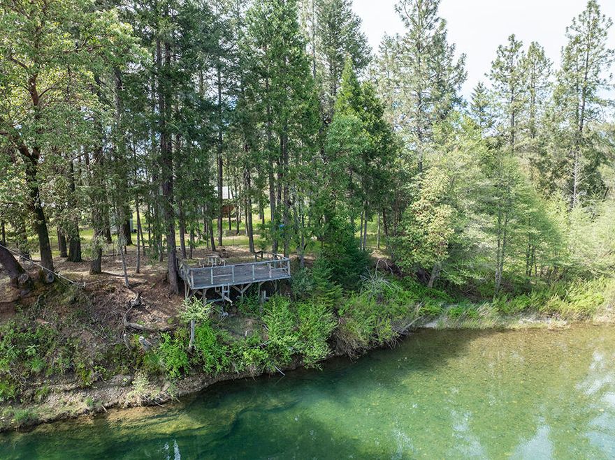 Contractor's Special on the Illinois River! Motivated Seller so don't miss this unique opportunity! Looking for privacy, space, and irrigation with riverfront charm? This 6.5-acre property spans two tax lots and offers excellent potential for agricultural use, including vineyard expansion. A Water Rights Certificate provides two acres of irrigation from the Illinois River, complete with a pump and sprinkler system already in place. The spacious 3-bedroom, 3-bath farmhouse is a work in progress, with quality upgrades underway. Bring your vision to finish it your way! With ample room for entertaining and comfortable living, this home is ready for its next chapter. Check with Josephine County Planning for options to build a second residence. Explore the possibilities and unlock the full potential of this riverfront offering. Seller is ready to make a move, schedule your showing today! Buyer to perform all due diligence.