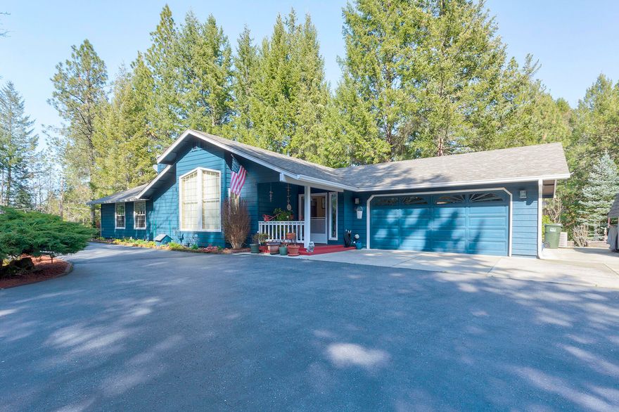This beautifully landscaped, 1772 SF home, was built in 1989 on 2.22 acres with 3 bedrooms,  2 baths & a 2 car attached garage.  The paved, circular driveway leads to the home & RV parking area. This quiet, peaceful & secluded property has been on the Grants Pass Garden Tour twice! Some features include deer fencing around most of the property, large, raised garden area, 20' x 22' back yard attached deck. Enclosed sun porch with hot tub,  two seasonal creeks running through the property, roof new in 2015, exterior paint in 2021, new range/oven & microwave. Recent home inspection, well water testing and the septic pumped. Interior of house has beautiful wood burning fireplace with electric fireplace insert with heat. Kitchen breakfast nook & formal dining room, walk-in pantry, hard wood floors, high vaulted ceilings. Central vacuum, emergency generator with separate electrical panel in garage. Be sure to see the full features list in the document section of this listing.