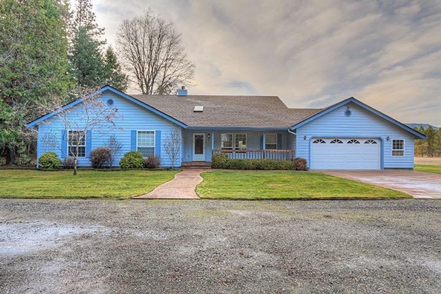 Immaculate Home and Property on 5.41 Acres in Williams! 3 Bed, 2 Bath 2,171 Sq Ft Single-Level Home with an Attractive and Comfortable Floor Plan. Enjoy a Large Country Kitchen with tons of Cabinets and Walk-in Pantry. Dining Nook plus Formal Dining, and a Spacious Living Room with Vaulted Ceilings and Woodstove. Home offers Large Bedrooms, and a Lovely Master Suite with Dual Vanities, Jetted Tub, and Separate Shower. Take in Mountain Views and the Peacefulness of the Valley from the Huge Covered Rear Deck. Parking includes an Attached and Finished Two-Car Garage as well as plenty of on-site parking. Fantastic 1,536 Sq Ft Outbuilding with Shop and Full Guest Quarters! Nice Fenced Garden with Raised Beds and Shed. Privacy from Neighbors and End-of-Road Setting make this a very quiet place to live. Property is Level and Useable, with a nice mix of Trees and Open Space. Fenced Pasture Area, and Beautiful Mountain Views. Fresh Paint in 2016, and New Roof on Home in 2017. Picture Perfect!