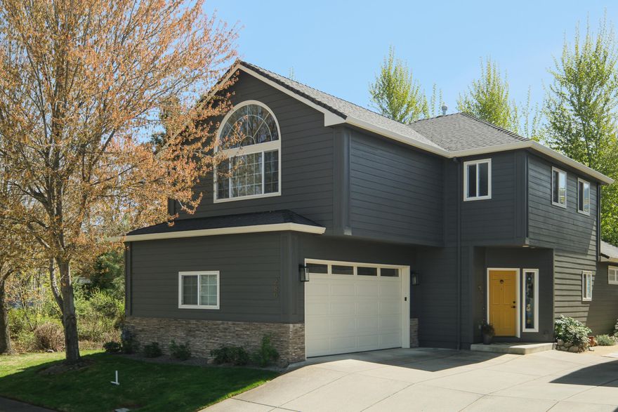 This delightful four-bedroom home in the desirable Meadowbrook Park neighborhood features an open floorplan, spacious main-level master suite, & vaulted living room. Stylish recent remodel by renowned local designer and architect combines carefully chosen colors and materials with thoughtful use of space. The main-level master with en suite bath has a sliding glass door to covered private back patio and could serve as an in-law unit. Upstairs are 3 bedrooms plus a bonus nook, perfect for a small office or yoga space. Largest upstairs room overlooks mature trees and feels like a treehouse! Abundant storage. Living room has a gas fireplace and plentiful windows, with a sliding glass door that opens onto a covered patio. Clay Creek flows through the wooded common area adjacent to the house, providing privacy and serenity. Gorgeous easy-care landscaping, mature trees, covered patios & hot tub create the serene yard of your dreams. Front yard maintained by the HOA.  Two-car garage