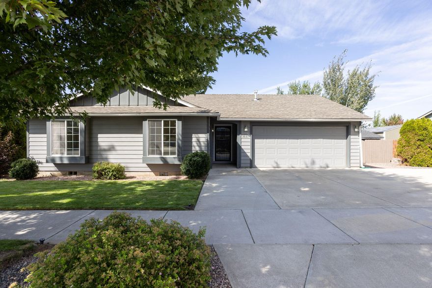 Mature tree lined streets welcome you to the desirable neighborhood of Village Pointe, located in SW Redmond. This meticulously kept single level home sits on a spacious .17 acre lot, with 2 car garage, large driveway and RV pad. Inside this 3 bed, 2 bath home you'll find real hardwood floors & tile throughout. Large, vaulted, open great room concept, gas fireplace with blower & gas forced air heating. Larger bedrooms including a primary bedroom with sliding patio door opening to your private backyard sanctuary.  Mature landscaping with garden area in the fully fenced backyard. Timed sprinklers in front yard, drip system in front and backyard. Backyard has a matching garden shed. Several upgrades have been made to this home including new A/C, quiet garbage disposal, interior paint plus other items. No HOA.