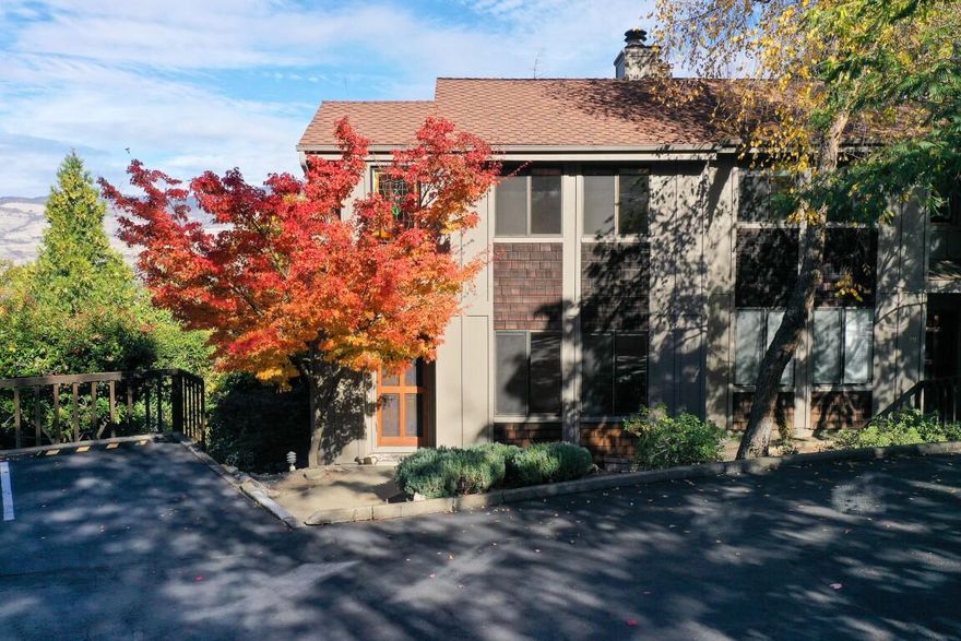 Nestled just blocks away from charming downtown Ashland, the Ravenwood Townhouses boast an enviable location and views. This tastefully remodeled end unit offers lots of light, privacy and rare outdoor space. This townhome boasts 1400 square feet of comfortable living which includes gleaming hardwood floors, a fully remodeled kitchen featuring a stunning tile backsplash and island work area, a large primary suite with walk-in closet and vaulted, full bath with skylight and a guest bedroom with its own half bath. Plus a conveniently located carport parking with good-sized storage. The $320 monthly HOA fee covers exterior maintenance, water, sewer, trash, access to the in-ground pool, and walkway leading to downtown. Don't miss this opportunity to own this exceptional townhouse!