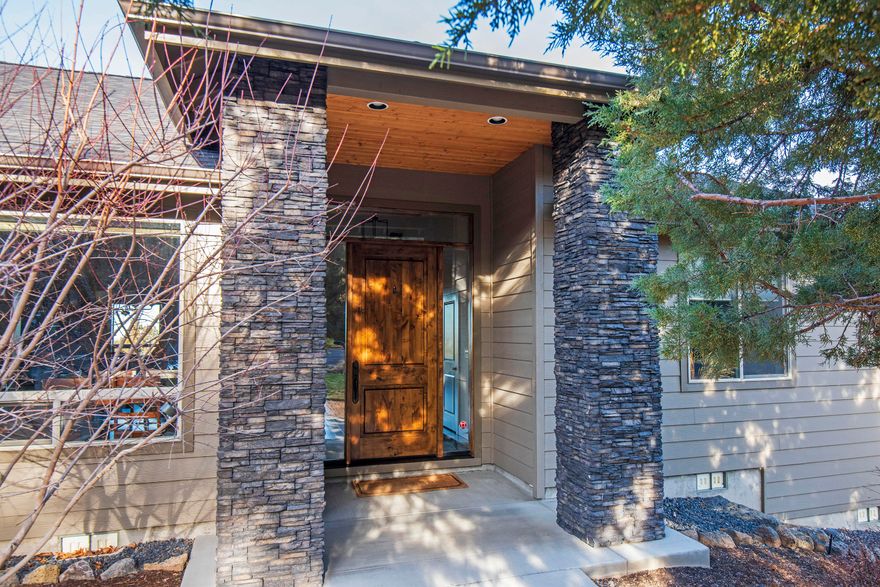 Step through the stunning 8 foot high custom front door and you'll immediately fall in love with this spacious home that combines Northwest charm, comforable family living and endless possibilities for entertaining indoors and out.  The expansive great room, with large deck and panoramic views of Smith Rock as its backdrop, features vaulted and beamed ceilings with massive skylights, troweled walls, and gorgeous hardwood floors.  The gourmet kitchen offers quartz countertops, under-cabinet lighting and high-end appliances to delight any cook.  A two-sided stone fireplane in the family room connects to a bonus room that welcomes family and friends for game nights and media madness.  The bonus room and two bedrooms are located to oneside of the great room with the master suite and and office or fourth bedroom on the other.  Attention to detail and casual sopistication make this incredible property a place you'll want to call home.