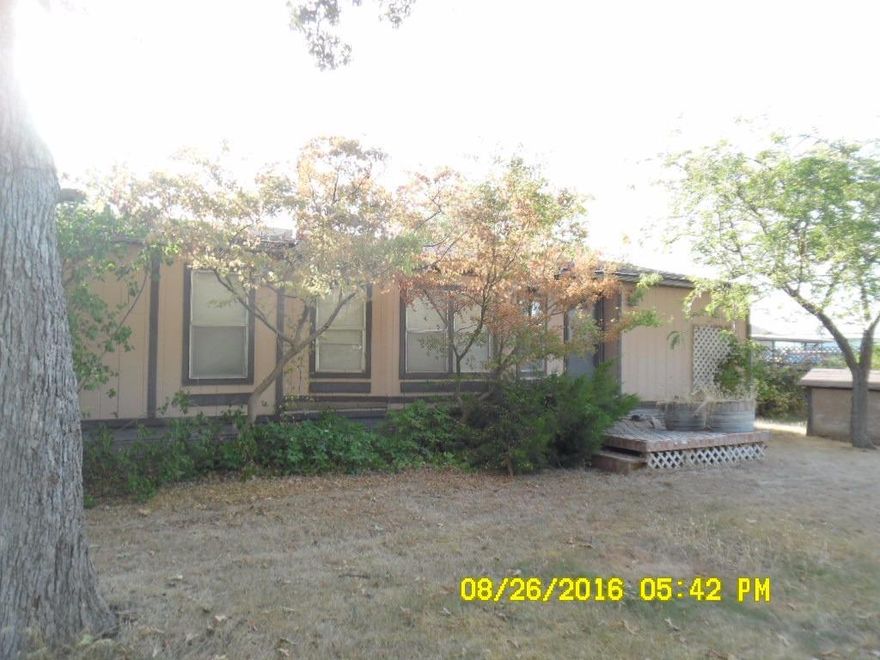 1985 Manor 26x48, 20x24 detached garage. Back half of property is fenced and cross fenced for animals and garden.