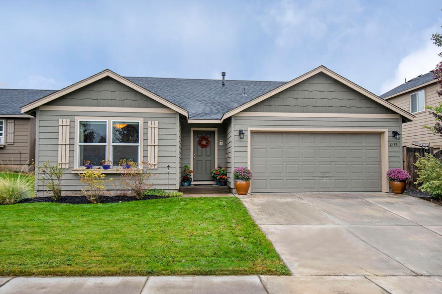 Welcome to this stunning single-level home! 
Inside, you'll find an open floor plan, featuring a living room with a cozy gas fireplace, perfect for chilly nights. The kitchen is an open concept, equipped with updated stainless-steel appliances, custom cabinetry, and a large island, ideal for meal prep and entertaining guests. Updates also include laminate wood flooring, newer carpet, and a fenced and landscaped backyard with a sprinkler system. The primary includes 2 closets and double sinks. Fabulous location in NE Bend near the hospital, parks and schools. Don't miss out on the opportunity to make this beautiful house your new home!