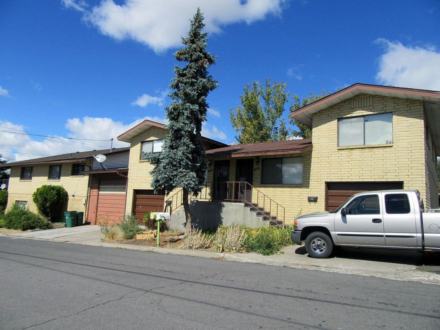 Very nice brick geothermal triplex in Hot Springs. Main unit has 3 bedrooms, 3 baths, new roof and newer carpet, vinyl and appliances in 2008, plus A/C, 2 car tandem garage plus work area. Rent is $995. Tenants pay water, sewer, garbage. The duplex has 2 bedrooms, 1 bath, + big utility/hobby room, 1 car garage and rents are $625.00 each unit and owner pays water & sewer. Tenant pays garbage. Low maintenance yard, brick exterior. Very nice money making units! Tenants all leases. RV garage in center of triplex. Subject to successful completion of a zone change from Medium Density to Apartments. Allow 3-4 months to close.