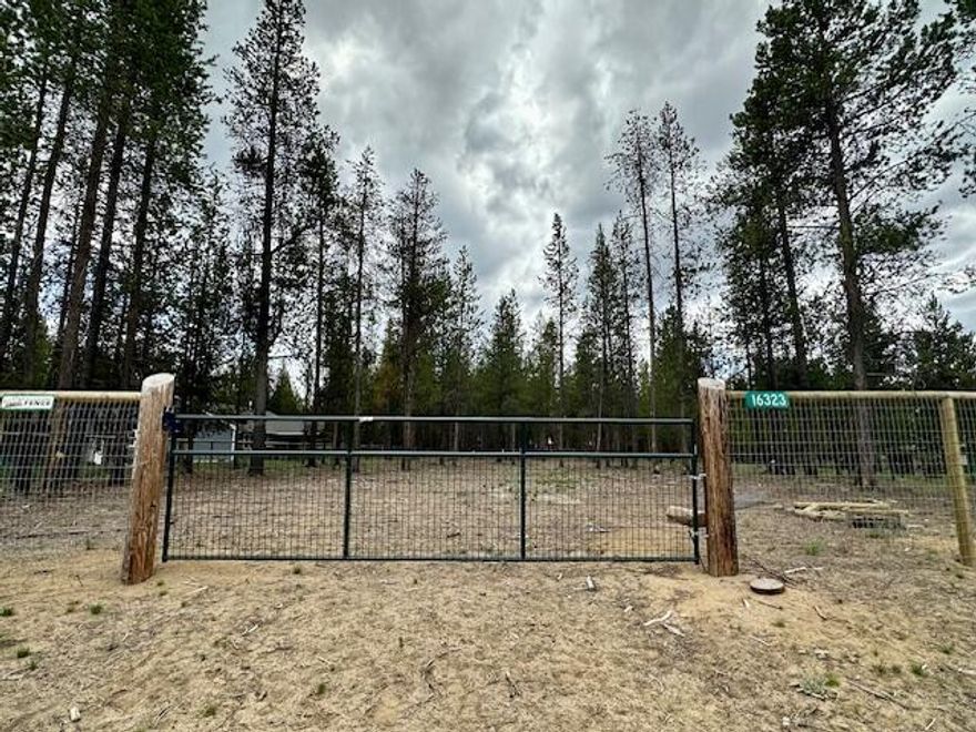 Located in a sought-after hot spot of Central Oregon, this fully fenced and gated 1.03 acre lot offers a rare opportunity to build your dream home. The property is clean, cleared and ready for development--perfectly positioned adjacent to an existing home for sale. There is a gate in between. This prime lot combines privacy with convenience in one of the region's most desirable areas.