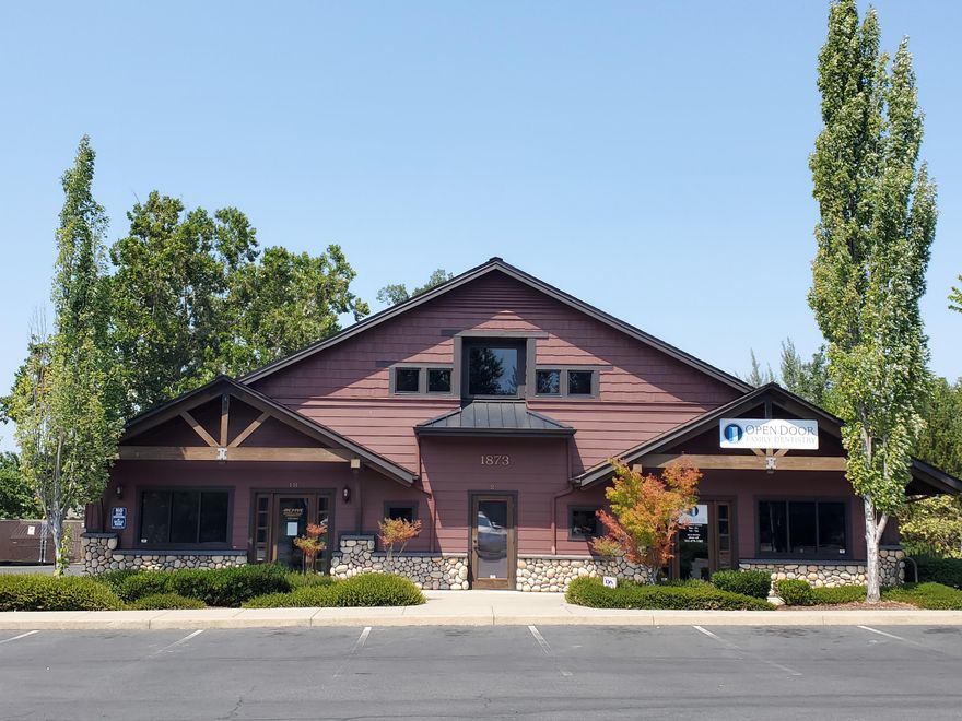 Beautiful medical/office complex built in 2006 in a classic NW style with cultured rock accents and attractive wood exterior trim. In excellent conditional, very well maintained.
 There are 3 units, existing tenant is using 2 spaces and one unit is vacant.  Total Sf of building is approx. 4930. There are 20 parking spaces and then the building also shares spaces with adjoining office complexes. Tenant is paying a partial NNN on one unit and a 2nd space it is built in to lease amount.