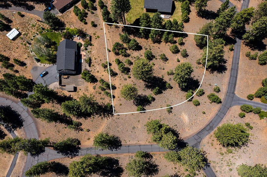 One of the last remaining undeveloped lots (.52 acres) in the Tollgate Community. Only 2 miles west of Sisters, the property is a short distance to Forest Service Land. Tollgate is a well maintained community offering miles of paved bike trails, swimming pool, tennis/pickleball/basketball courts & clubhouse. Community water & monthly HOA dues of $113 per month total.