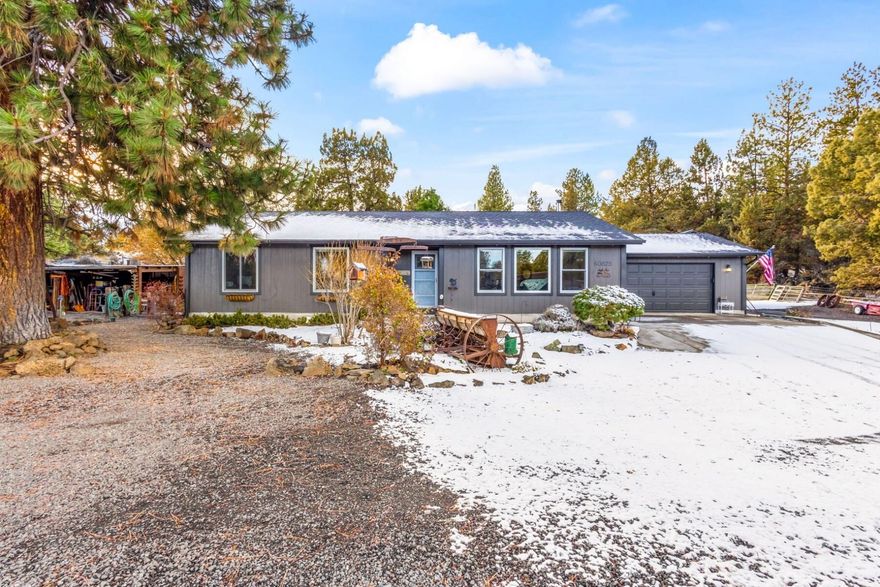 This upgraded single-level home features a newer 30-year roof, new Anderson windows, quartz countertops, updated LVP and carpet, and a spacious covered patio with a hot tub. The property includes a shop with a pit, 20' Conex container with lights, 2 large RV Covers with power, chicken coop, and a barn with 2 stalls, hay storage, and a concrete-floored bay. Equipped with a security system and 200-amp service to both the house and shop. Located within the Urban Growth Boundary and UA zoning, offering numerous permitted uses—ideal for developers or those seeking future growth potential.