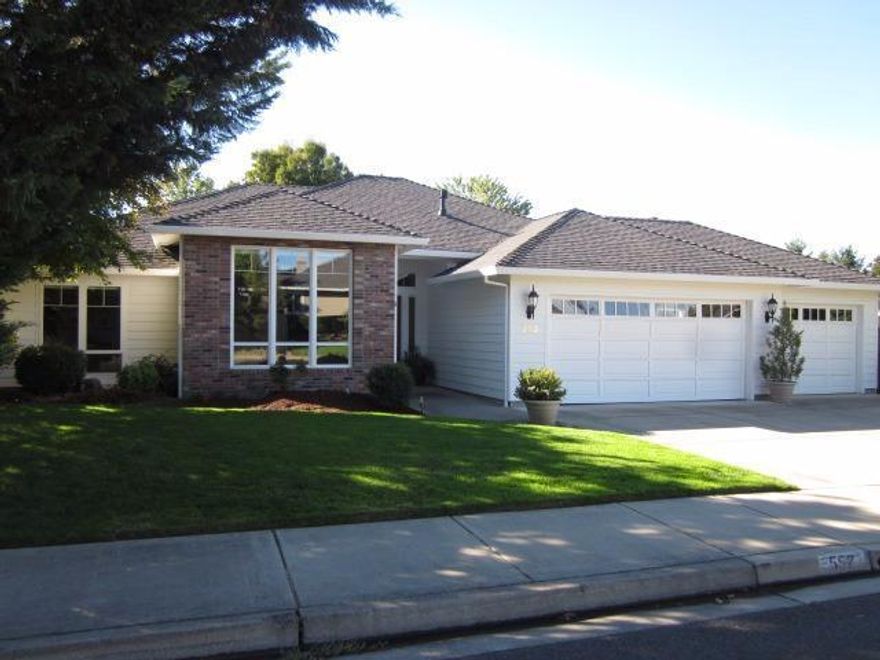 Great home, great location, this single level home features an open floor plan including raised ceilings, formal living room with glass french doors: formal dining room or office; a spacious kitchen boasts abundant cabinetry for storage with granite counters & gas stove; oak wood floors; breakfast nook; family room with gas fireplace and sliders to the large stamped concrete patio with built-in gas BBQ. Master suite also has slider door to tiled patio & backyard access; all closet customized with connection shelves, drawers & rods. It has a 3 car garage w/pulldown, lit storage above and automatic sprinklers and drip gardens. Near hospital with RVCC just around the corner and within walking distance of coffee shops and dining; truly a home to enjoy.