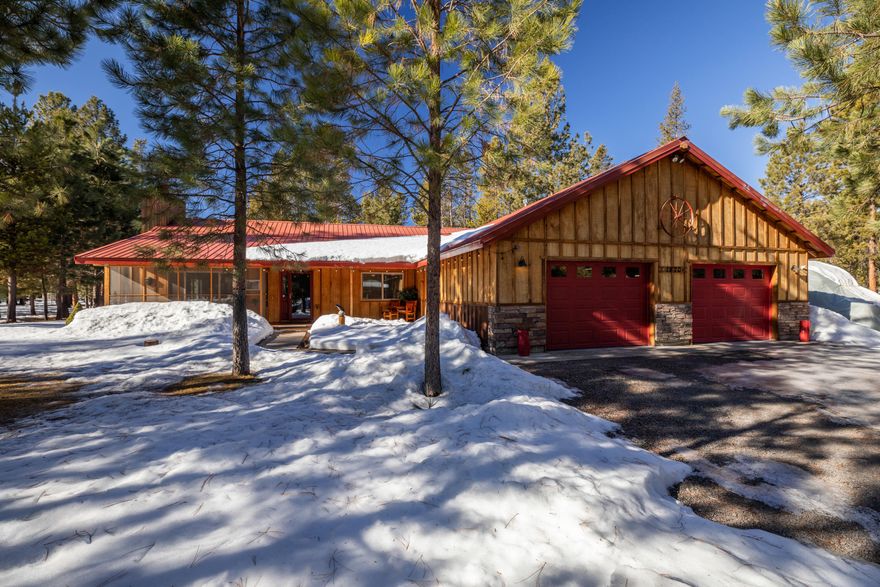 Outdoor recreation among the Ponderosa Pines right from your doorstep! Beautifully remodeled single-level home on a secluded cul-de-sac. Water feature in front. Very active Firewise Community. Interior design includes an open style, high ceiling living area. New LVP flooring, carpet, ceiling fans, tiles walk-in showers, soaking tub and heated towel rack. Private door from master bedroom leads to a covered hot tub and private exterior hot shower for those warm summer mornings. Extra wide double-car finished garage with plenty of storage shelves and epoxy floor. Half-bath in garage. Exterior buildings include a heated workshop with a roll-up garage door leading to its deck and a separate building for additional covered storage or hobbies. RV parking with full hookups. All structures have metal roofing. Home is immaculate and expertly maintained.