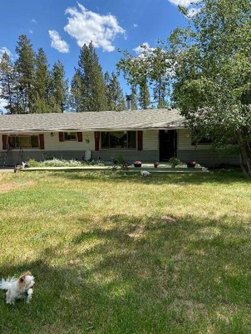 PERFECT MULTIGENERATION HOME. One end of the home features a bonus room that could have multiple uses for a master bedroom, family room or a great area for an apt. It features an attached bath with a senior tub, kitchenette or wet bar. A woodstove & door out to the spacious deck. Attached to the bonus room is also an office area and laundry room which leads into a spacious kitchen with lots of Blue Buggy pine cabinetry & lots of counterspace. Next is a formal dining room with a big bay window. The living room is cozy with a wood fireplace to keep you warm on those cold Winter nights. The main bath features a privacy bathtub and toilet. Next is 2 other bedroom with walk-in closets & a spa room attached to one. There is a huge back deck and large front deck going out to a huge 1800 sqft garage shop with Triple doors on the front & 2 on the back to drive through. Plenty of room for all the toys and to have a big workshop. All this on a 2+ ac corner lot at the end of the road for privacy.