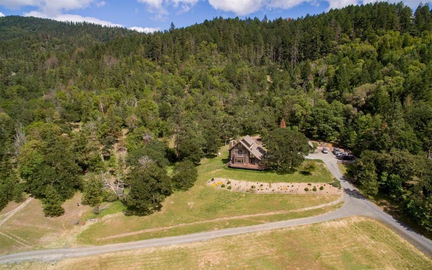 157 acre private paradise consisting of 2 taxlots & 2 residences. EFU zoned & water rights for 69+ acres. The property has unsurpassed stunning views of the Williams valley located in the greater Applegate valley. This would be a fantastic vineyard or any number of ag applications for growers looking for multiple tax lots & superb privacy and security. Vast limited access BLM abuts the property. The main residence is a custom 3377 sq ft 2 story 3 bedroom 2.5 bathroom with rich woodwork throughout the home. There are stately rock fireplaces in both the Living room & the master suite. The main house overlooks the scenic valley. The second taxlot has a homestead house of little value but has a separate address & anchors the property for additional home with even more spectacular views of the valley. The property has a yearly creek and multiple springs & ponds that are the source of the water rights that make this property so attractive. This is a very beautiful & private property!