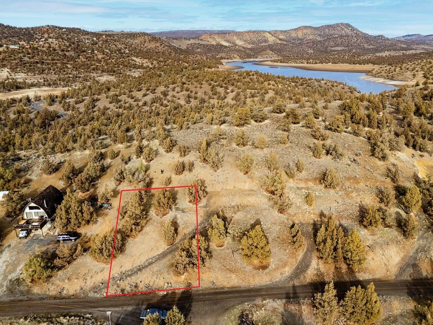 Enjoy stunning Prineville Reservoir views from this .25-acre lot in Bottero Park. Perched atop a knoll with panoramic vistas and backing to BLM land,. This property offers opportunity for endless outdoor enjoyment. Power is at the road, a septic was installed in 1980 (buyer to do due diligence) may need to be replaced. Community well water is available, connection is at street. Just minutes from Jasper Point and Prineville Reservoir State Park for boating and recreation. Seller also owns the adjoining parcel and will sell separately or together at a discount. A perfect getaway spot or future homesite surrounded by Central Oregon beauty.