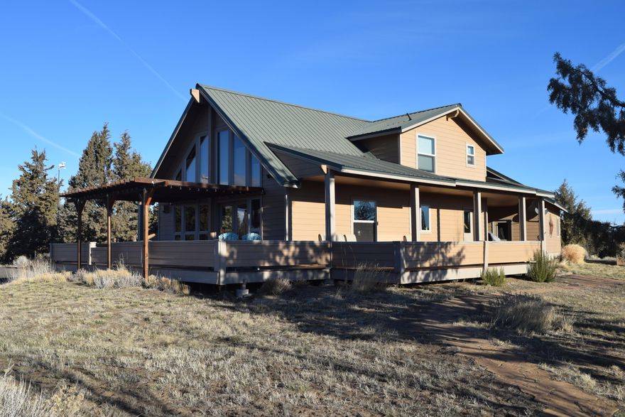 Wonderful custom built CRR home on a paved road. Custom designed with vaulted ceiling, hardwood floors, wrap around covered porches, large tiled double walk in shower, open loft style office /library with views, large garage storage area plus separate office /man cave. This is an extremely well built and maintained home.  Includes large  covered RV storage structure and plenty of land to expand.  Could easily be converted for horses, especially with its proximity to BLM lands and the Deschutes River trails. Oh; and then there are those fabulous Cascade views.