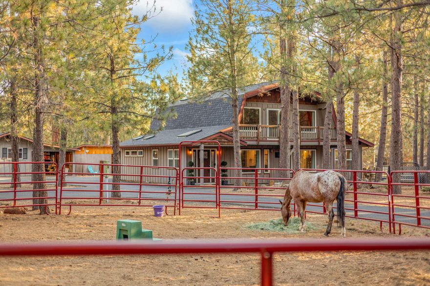 BRAND NEW exterior paint on all structures and most of interior repainted! Fully functioning, ready to go horse property with two-stall horse barn, two paddocks (able to open into 1 long run), round pen, hay storage, tack area and access to 1000's of acres of USFS land with miles and miles of riding trails. Home has two offices in addition to three bedrooms. Home features: Open floor plan, newer downstairs flooring, updated kitchen with large island, quartz countertops, stainless steel appliances, high vaulted ceilings with tongue and groove, plenty of windows and skylights providing natural light, oversized primary bedroom downstairs, mud room, laundry room & canning room. Property features: Large paved circular driveway with lots of parking, garage/covered parking for 2 vehicles plus additional workroom/storage room, three year old roofs on barn/garage and six years on home, new HVAC system with high end filter, kennel and fenced yard for dogs, Pine treed lot minutes from Sisters.