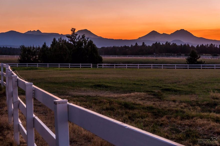 Rare Offering: 19 acre Equestrian Estate in the Heart of Tumalo with Massive Cascade Mountain Views. White fenced pastures, arena & 8 stall Barn with office space & separate 1300SF guest quarters. This elegant 4700SF home sits on elevated property providing one-of-a-kind views of Central Oregon from all directions. Wrapping porches & decks surround the home providing exceptional outdoor entertainment & relaxing views. Enjoy the thousands of acres of public lands, just minutes away.