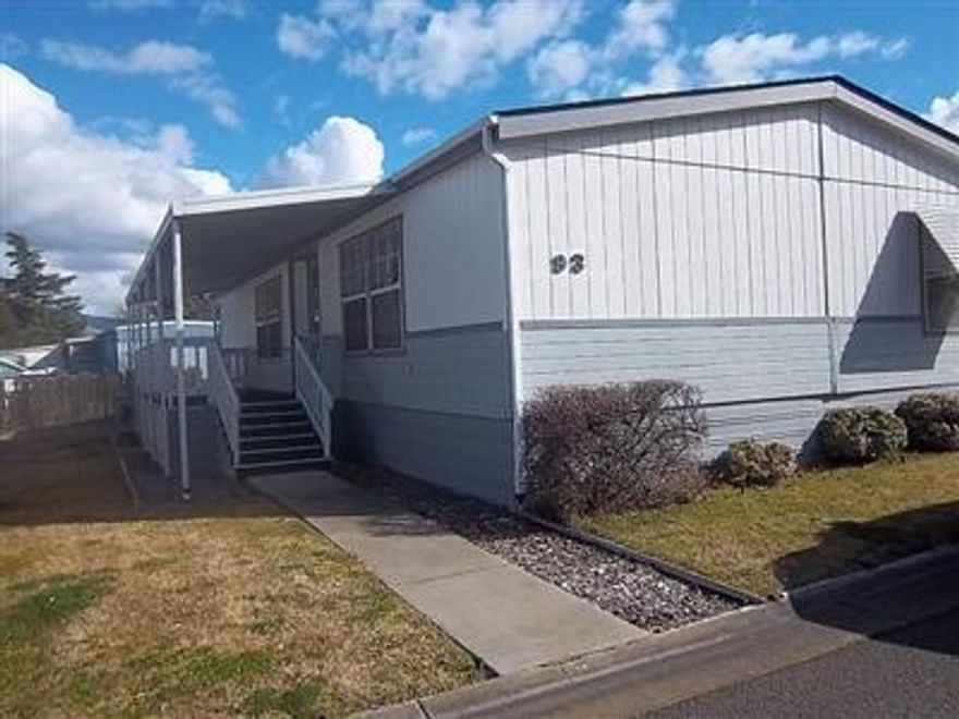 Clean, neat curb appeal with nice large covered front porch. Bedrooms are all quite large. Great pantry in kitchen, nice shed in carport area. Very nice 55+ park.