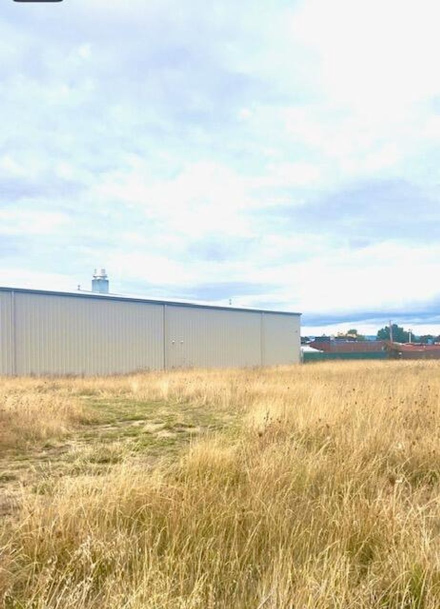 Prime Location of nearly 1 ac lot (.84) zone Light Industrial. 5 mins to Medford Airport and Costco. Street nearly completely built out with new warehouses/ storage and manufacturing. Too many uses to list- buyer to do all diligence.  Utilities at property line. Possible seller carry with 50% down.
