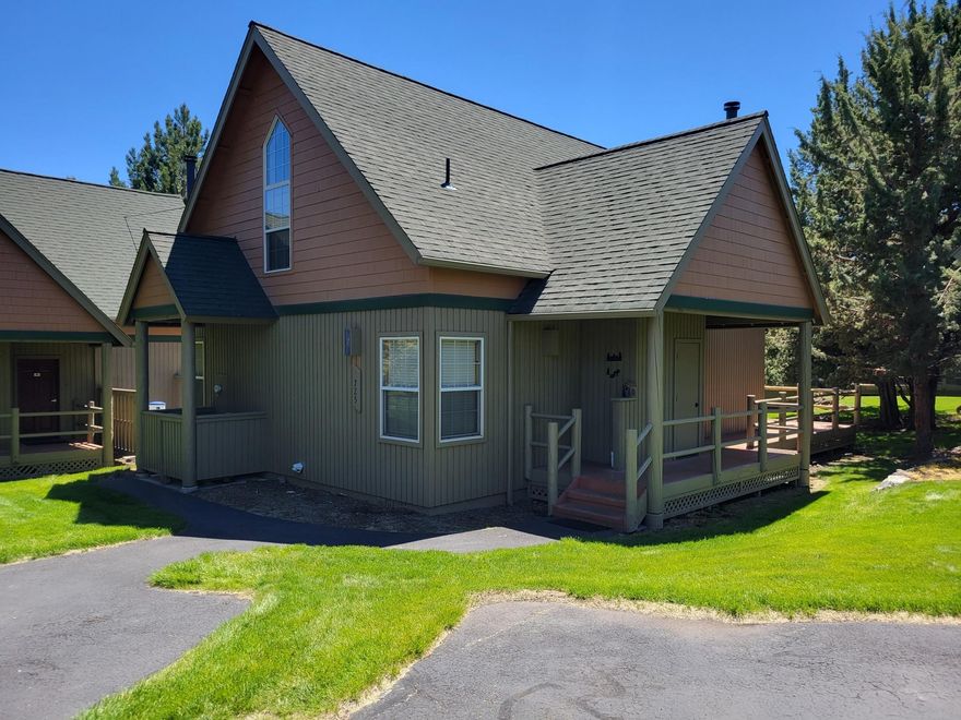 Eagle Crest Chalet! This is a beautiful 3 bedroom, 2 bath chalet overlooking a greenbelt area with trees for privacy near the resort pond water feature. This home is a short term rental with solid rental history. Owners and guests have full usage of the amenities at Eagle Crest including 3 Sports Centers and pools, tennis and pickle ball courts and many miles of walking and biking paths. Inside the home is offered furnished and boasts fresh paint, upgraded high end laminate wood flooring and tile, newer refrigerator, TV, master bed mattress, wifi lock and smart thermostat and has had consistent maintenance and upkeep. Relax on the nice wrap around deck with trees for privacy, recline by the wood burning fireplace in the great room (the chimney was swept in 2021) and enjoy good natural light throughout. The furnace has been serviced regularly and the HOA will be painting the exterior and replacing the deck and railing boards this year. What a great place!