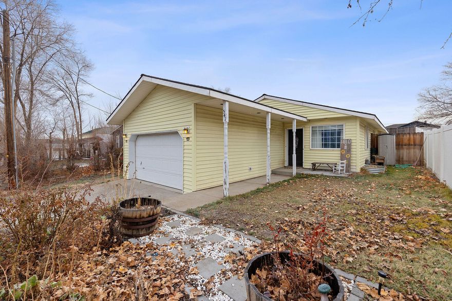 This beautifully updated 3 bedroom, 2 bath home has been lovingly refreshed and is truly move-in ready! With 1,189 sq ft of bright, welcoming space, you'll feel right at home the moment you walk in. 
The living room features an eye-catching electric fireplace wall- perfect for cozy nights- accented with shiplap, custom shelving, and soft natural light. The kitchen has been thoughtfully updated with painted cabinets, modern hardware, a stunning backsplash, stainless steel appliances, and plenty of room to cook, entertain, and enjoy everday life. 
Three comfortable bedrooms give everyone their own space, while both bathrooms offer updated vanities, fixtures, and stylish touches. The home also includes fresh flooring, newer paint, and a clean, modern feel throughout. 
Located in a peaceful setting with room to relax and enjoy, this home is the perfect blend of charm, comfort, and convenience. Don't miss your chance to make it yours!