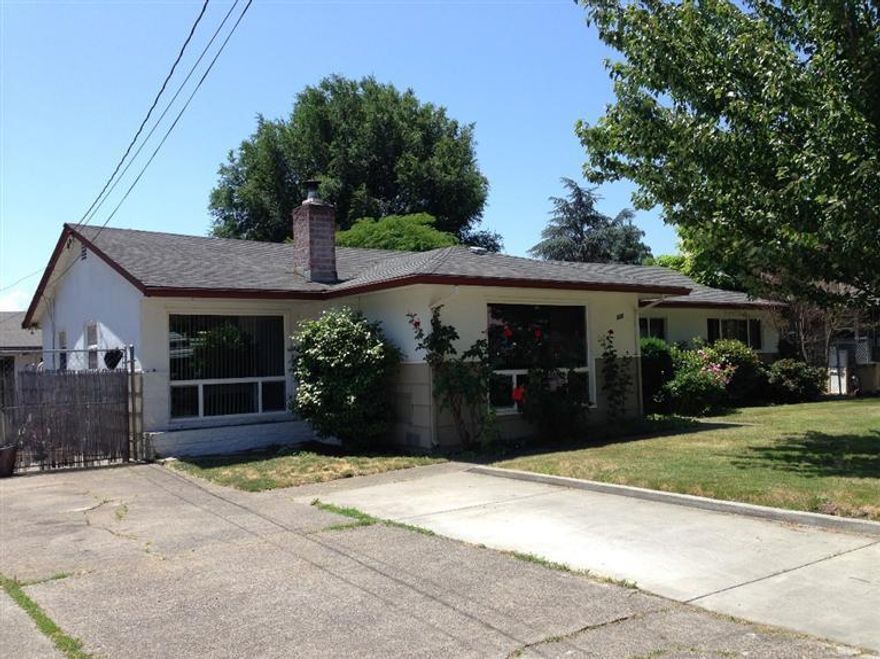 Great place to call home with all the convenience of living in NE GP. Newer vinyl windows, beautiful bathroom makeover, solid oak flooring, roomy living room with cozy brick fireplace, double door den with kitchen and outside access, and tons of potential in the detached garage/shop/laundry room/ with cool outdoor kitchen on the covered patio. Bring your fresh ideas and enjoy how solidly homes of this vintage were put together!