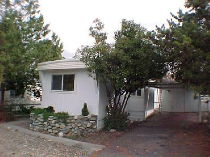 Must have current DMV license to sell. Singlewide in great condition with two tipouts that provide for a more spacious floor plan and laundry room. Remodeled in 1999 including thermal paned windows throughout, new kitchen & front bath sinks and faucets, vinyl flooring, exterior paint, new carpeting. Roof vinyl covered and foam insulated in 1998 and heat pump was retrofitted. Water & sewer included in $370 space rent. Close to bike & walking path and YMCA. Mature landscaping including rock work. Owner may carry.