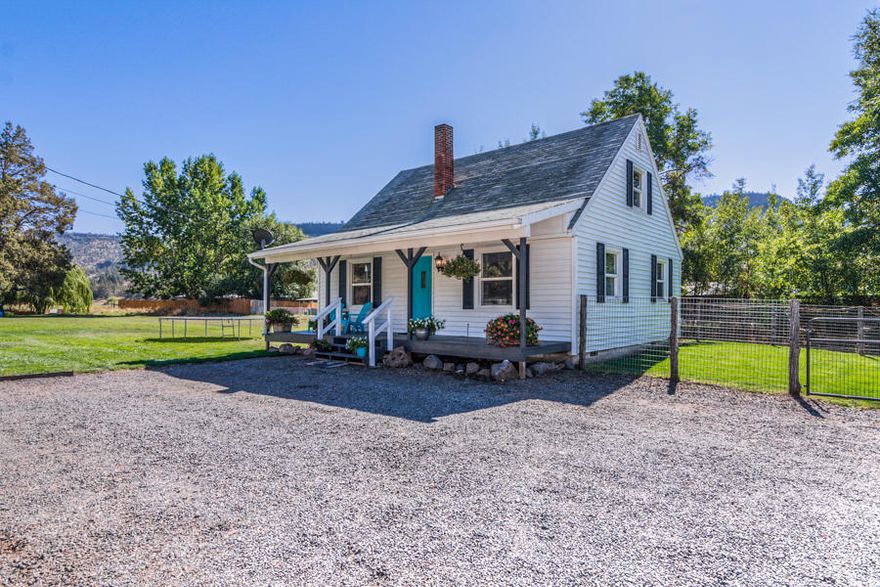 If you've always wanted that little white farmhouse, here it is! Picturesque 1940 farmhouse in Prineville! 3 bd 1bath 1232 sqft. on .81 acre!  Quaint and comfortable, there is a lot of potential with this property as it sits on two tax lots! Enjoy the charming built-ins and the inviting front porch. Downstairs has a beautifully updated kitchen with farm sink, tile floors and granite counters, one bedroom, living room, and bathroom, upstairs includes two additional bedrooms with great storage and built-ins.   This home is ready for your personal touches and will look fabulous with Christmas lights!  Enjoy the sounds of the seasonal irrigation canal from your back deck while drinking your morning coffee.