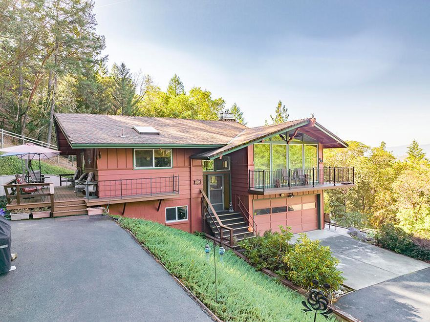 Perfectly Located 3 Bed, 2 Bath 2,690 Sq Ft Rural Home on Acreage just moments from Town! This Home is located at the Very End of a Desirable Dead-End Country Road, & offers Absolutely Stunning Views of the Valley & Mountains Beyond. The Home offers a Large Living Room with Gas Fireplace, a Huge Kitchen with Island & Tons of Cabinetry, Dining Room, Two Nice Guest Bedrooms, & a Downstairs Family Room with Fireplace! A Wall of Windows in the Living Room brings in the Dramatic Views. A New Wrap-Around Deck, New Vinyl Windows, & Newer Heat Pump are just a few of the Recent Improvements. Other Fantastic Amenities include an Attached & Finished Two-Car Garage with Storage & Benches, Paved & Gated Drive, Detached 32'x20' Workshop, Garden/Equipment Storage, Hot Tub Room, & Large RV Port! The area around the Home is Fully Fenced & offers some Nice Landscaping. Privacy from Neighbors. This Home & Property offers just about everything you would need & is so conveniently located Moments from Town!