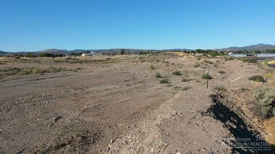 One of the few HM zoned properties available in Crook County. This 9.72 acre parcel has possible rail access and is located across the road from the City of Prineville's Railroad Depot. Just a few miles north of Prineville with great access to US Hwy 26. There is currently 1 acre of ground being leased out for storage, this brings in $500.00 per month, it is a month-to-month agreement. Property across Bus Evans Road also available. Maps and information available.