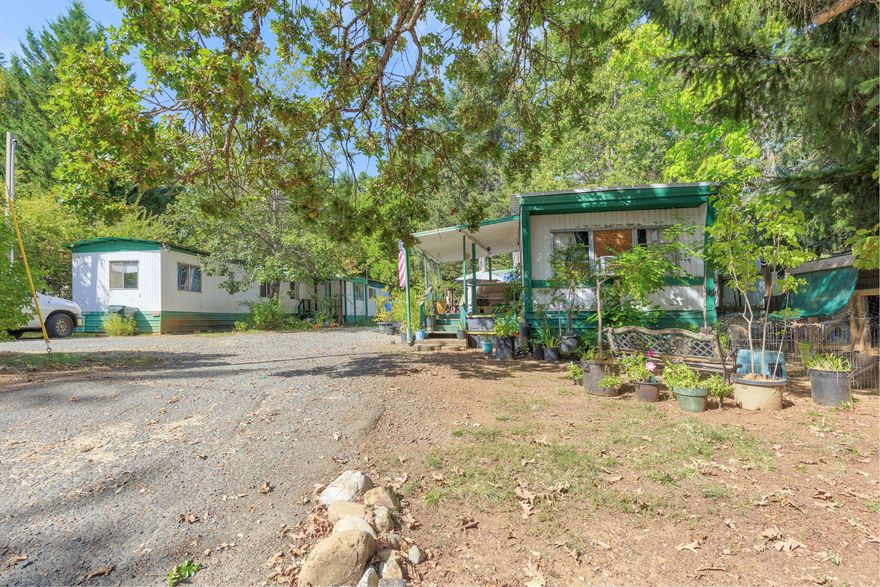 Attention Investors!! Looking for a way to get into real estate investing with a property that has positive cash flow, happy tenants  and low expenses? Or a replacement property for your 1031 funds? Look no further! This income earning property has two mobile homes with long time renters. Unit A is a two bedroom, one bath, 576 SqFt single wide mobile home that rents for $850 a month. Unit B is a three bedroom, two bath mobile home that rents for $1025.  This investment property has a net operating income of over $17,000 a year with a cap rate of over 13%. Owner Carry Options available!  Don't let this opportunity pass you by! Call today for more details!