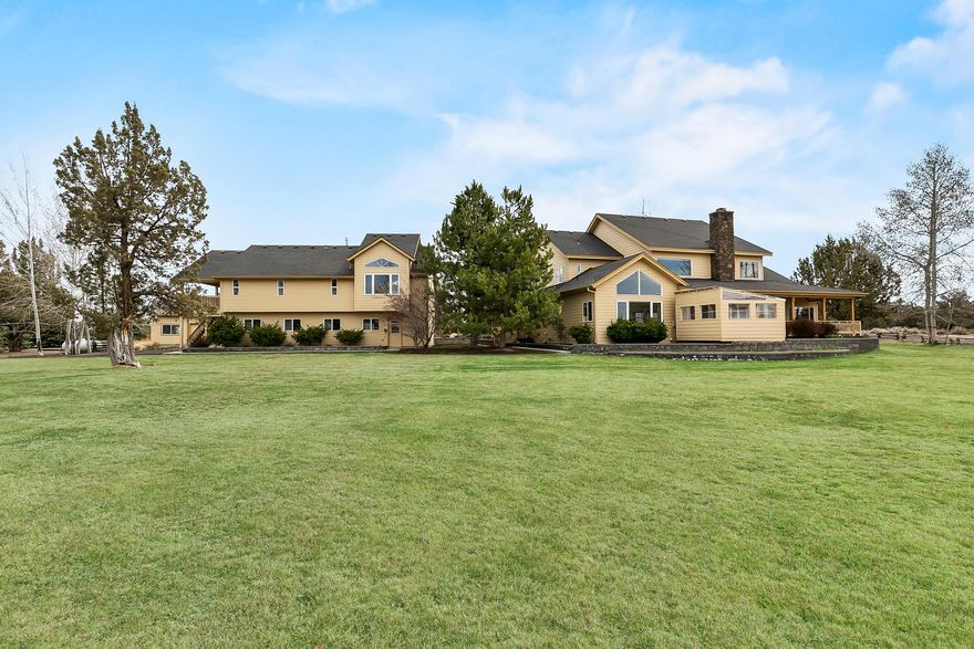 Beautiful private country estate in gated community on 20 acres. Magnificent views of the Cascades, guest house, shop, backs BLM, in ground sprinkler and drip system, immaculate mature landscaping. Gourmet updated kitchen, 2 sinks, kitchen island, propane cook top and warming drawer, wine nook, extensive cherry cabinetry and spacious walk in pantry. Cherry floors, breakfast nook and bar. Open floor plan, primary bed on main, bonus room/loft w/privacy, mud room/laundry room has extensive cabinetry and sink. Wood burning fireplace with propane start and wood storage. Wrap around porch, covered deck on the west side of the house with propane hook up for your BBQ. 1554 Sq Ft guest house features 2/b 1/b, views of the cascades, kitchen and living area, propane heating stove, electric heat, heat pump, porch/deck. 3 bay oversized garage. 1700 SQFT shop, RV door and 10' door and att. garage. Generator sys. 1000 gal propane tank will automatically run the house, guest house, garage and sho