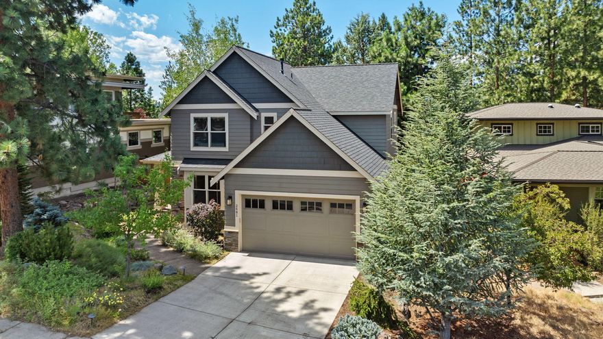 Tucked into an iconic NW Bend neighborhood, this ultra efficient home is ideally located near Shevlin Park, trails, eateries and schools. Thoughtfully designed for a low-maintenance lifestyle with an ultra-quiet, energy efficient HVAC system and 8.8 kw, 22 panel solar system to keep you comfortable at minimal expense. On the main level, a spacious great room opens to a covered patio with a ceiling fan, perfect for enjoying the beautiful Central Oregon evenings. A separate office near the front entrance adds versatility to the floor plan for work, school or hobbies. Upstairs are three bedrooms, including a primary suite & a full guest bathroom. The 3-car tandem garage provides ample storage, ceiling racks, an EV charger & 2nd EV plug. Add in the easy care, low-water landscaping highlighted by colorful perennials, and this home is the complete package; a close-in, quiet retreat with eco-friendly features, 10 out of 10 on the home energy audit & ready access to all that Bend has to offer