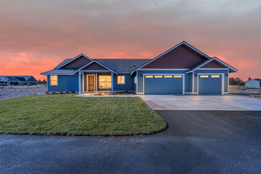 Beautiful Powell Butte home on 5 acres with panoramic Cascade Mountain views! This 1,946 sq ft single-level home features an open floor plan with vaulted ceilings in the main living area and primary suite. The kitchen offers hickory cabinets and solid-surface countertops throughout. Spacious primary suite includes a large tile walk-in shower and oversized walk-in closet. Enjoy the huge 3-car garage with additional covered area behind—perfect for equipment, storage, or hobbies. Horses welcome! Paved driveway, wide-open views, and peaceful country setting just minutes from Redmond and Prineville. Please use OREF forms Builder is buyer friendly.