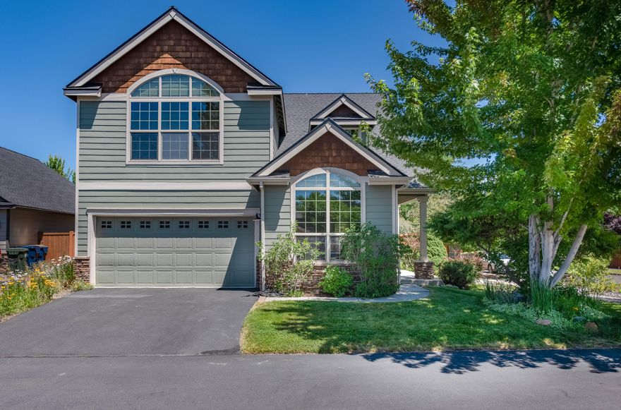 Rare find in NE Bend, this spacious and well-maintained home offers nearly 2,700 sq ft with 3 beds, 2.5 baths, an office/den, and a large bonus room. Located on a beautifully landscaped 0.2-acre corner lot, the home features peekaboo Cascade Mountain views. Major updates include an owned security system, new roof (2021), new water heater (2020), and new HVAC system (2025). Interior highlights include granite countertops, stainless steel appliances, a Blanco Diamond Silgranite sink, Kitchenaid dishwasher with grinder, and induction cooktop. The kitchen and dining areas feature heated porcelain flooring, and the living room includes an upgraded fireplace with custom stonework and mantle. A 3-car tandem garage offers extra storage, plus a covered deck and travertine patio surrounded by mature landscaping and specimen trees—ideal for outdoor enjoyment. An 8x10 Tuff Shed provides additional storage.