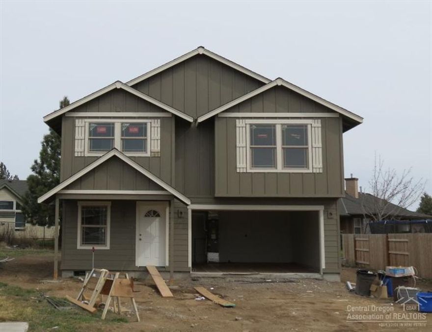 Brand new home is located in SW Redmond's neighborhood of Julina Park. Featuring 3 bedrooms, 2.5 baths, large master suite with huge walk-in closet, double sinks and shower. Kitchen offers an abundance of Knotty Alder cabinets, a large island with eating bar and a separate dining room. The front yard is landscaped with sprinkler system, double car attached garage. The home is new and vacant and located in SW Redmond for easy access to Bend.