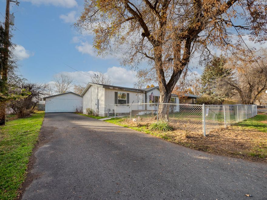 Priced to sell! 2011 3bd 2bth manufactured home with vaulted ceilings, fenced yard, accessible ramp, walk-in shower, and 24'x24' detached garage. Lots of parking and storage.