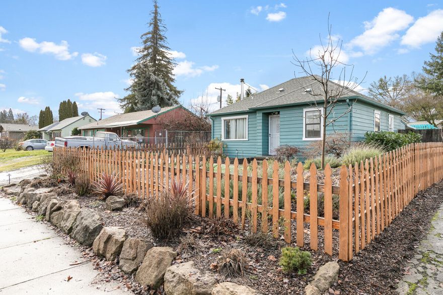 Charming and Cozy home, conveniently located in downtown Medford with shopping and medical nearby. This Single-owner home sits on a .14 acre lot with alley access. Recent updates include a new roof and vinyl along with a landscaped front yard. Attached is a 408 Square Foot garage and storage room. The interior includes a large open front room, Kitchen, lower laundry room, a bathroom, and storage.