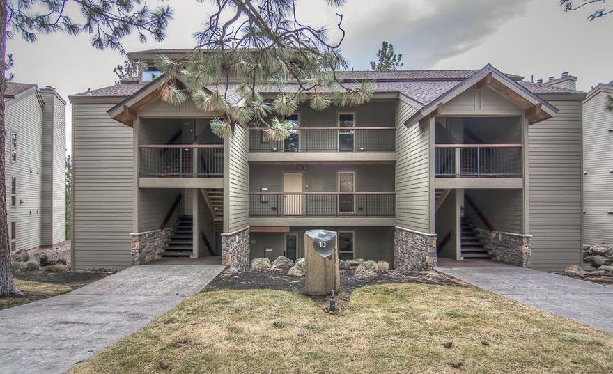 Experience the best of both worlds! A cozy mountain resort and a European style, fully remodeled luxury ground level condo with exquisite modern finishes, touches of stone, timber and iron. This end unit delivers river views below and wilderness canopy pines. The great room and dining area feature a sleek fireplace wall adding elegance to the entire room. The galley design kitchen is complimented with modern lines, waterfall quartz and stainless steel. All this with easy access to downtown shopping, river activities and Mt Bachelor. There is no other unit that has been so lovingly and tastefully remodeled with high end finishes. Quality and luxury surround and will impress friends and renters alike.