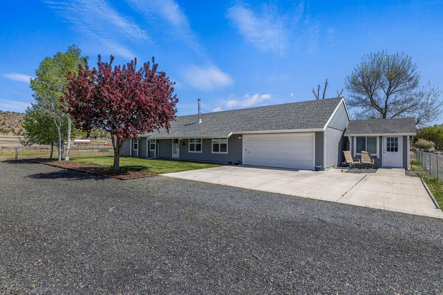 Welcome to your slice of country paradise! Nestled on 4.78 acres on a peaceful corner lot, this 3 bed,2 bath single level home offers views of Mt Jefferson and is lovingly maintained. The property includes a 3600sq' arena, a 1224sq' barn, and a 1260sq' hobby stable-all ready for your livestock, hobbies or dreams. The insulated shed was a dog grooming salon; finished nicely and has water and electricity. Domestic and irrigation wells are in place, and the land is fenced multiple ways for easy use. Newer: carpet, vinyl windows, 3 mini-splits and a woodstove for your comfort. Room to roam, space to grow - this is the country life you've been waiting for.  Call your favorite Realtor and come visit soon!