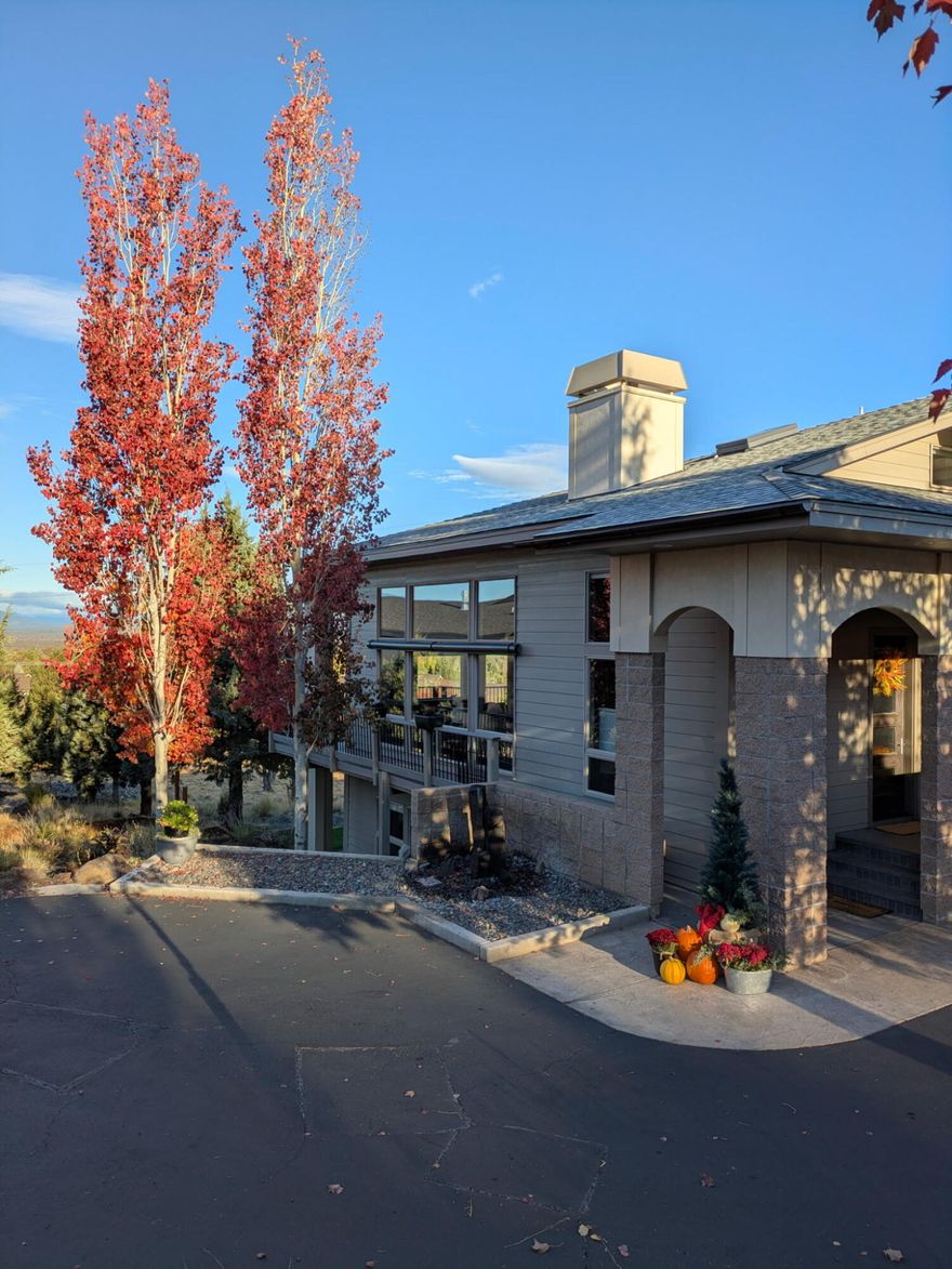 Harmonizing with the high desert, this unique, Eagle Crest West Ridge home implements concepts from the SW and Mediterranean with super energy-efficient, passive-solar features and fire-resistant block walls for all-season comfort and safety. Insulated to 2x the International Energy Conservation Code, it has 3 bedrooms/ensuites on separate levels with expansive mountain views from the windows, balcony, deck, and patio. A basalt water feature introduces the light-filled great room with stained concrete floors, artisan tile, high-end finishes and wood burning stove. Main floor ensuite offers stair-free, independent living; upper level ensuite offers solitude and mountain views; coffee on the balcony, late night star gazing or a read in the nook. Multi-purpose, lower-level ensuite (currently art studio), has full bath, separate living area, private entrance and patio. Extras include covered, wrap-around deck, hot tub, enormous finished storage area, and spacious garage with shop area.