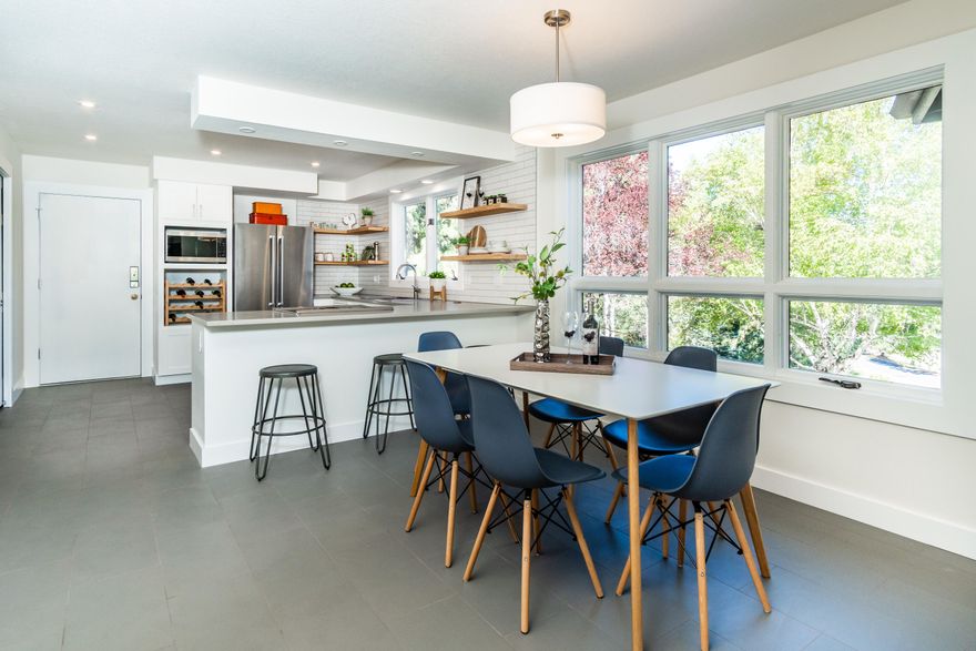 Beautiful, fully remodeled home in a one-of-a-kind neighborhood.  1+ gorgeous acres, mature trees all-around the home, plus rock outcroppings provide visual beauty, premium privacy, and hard-to-find peace and tranquility only minutes to downtown.  The lot & common areas provide a unique expanse of beauty for families to play and explore. Walk to Awbrey Meadow's private river access or onto the Deschutes River trail just feet from the property.  Brand new finishes & appliances, open living spaces with midcentury roof lines, and an open beam structure.   
Kitchen/dining area offers brand new quartz countertops with bar seating, a deep stainless-steel sink, warm LED lighting, and large windows for natural light.  Plenty of pantry storage & huge hideaway cabinets in the adjoining utility/laundry room. Bath and Kitchen cabinets feature soft-close, shaker doors, and nickel hardware. Remodeled bathrooms have all new surfaces, custom quarter-sawn oak countertops, modern sinks & nickel hardware