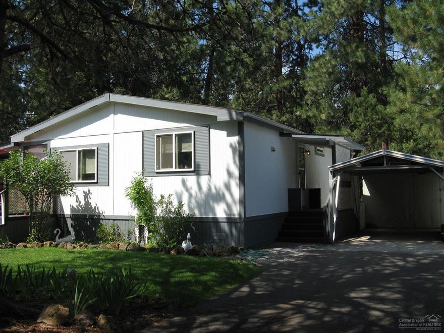 Very comfortable and well cared for manufactured home.New roof in 2012,40 Gal Hot water tank in 2017, new light fixtures throughout the house.Outside features include above ground sprinkler system, storage sheds & updated carport.Clubhouse has pool tables, W/D facilities, indoor swimming pool & much more. HOA includes water/garbage/yard debris pickup & sewer.Pets are subject to restrictions. Must be approved by park. Includes 1 year Home Warranty. Could be turned into 3 bdrm at Buyer's expense