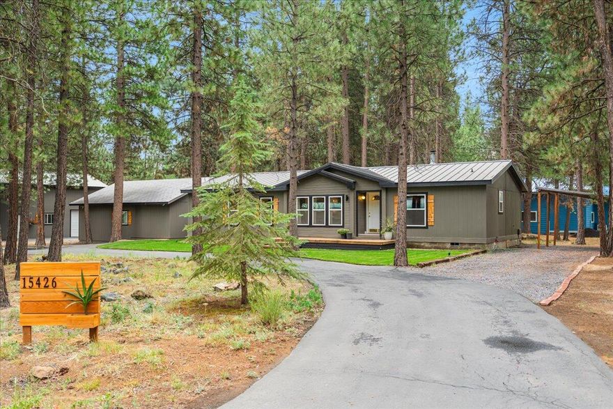 Welcome home to the serenity of forest living paired with the luxury of custom finishes, nestled on a peaceful, tree-lined 0.70 acre lot within the serene Ponderosa Pines community. This home offers 2,103 square feet. The open layout connects living, dining, and kitchen areas- perfect for seamless everyday living. In the attached 2-car garage, you will find a private fully insulated office with a wrap around finished wood slab desk, the perfect space for small businesses and work from home life. Store all of your tools and toys in the oversized detached shop perfect for RV storage and shed with wash-out. Live exceptionally in the Pines with paved roads, low-cost HOA services, and year-round road maintenance for hassle-free rural living.