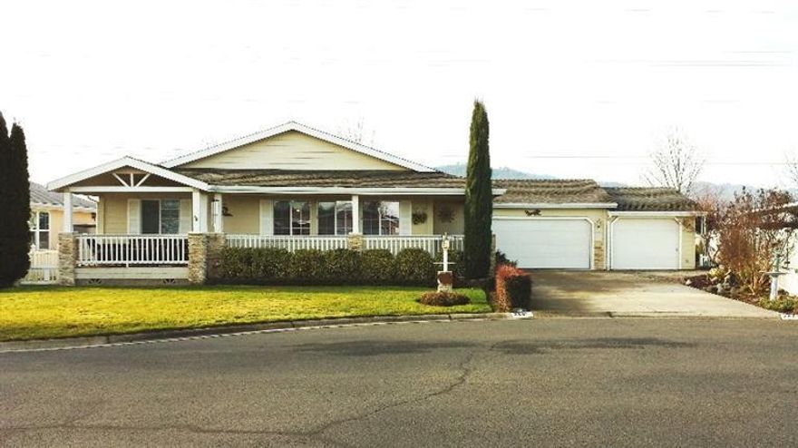 This home is located in the wonderful 55+ Miller Estates, built in 2000. From its immaculate streets and sidewalks, to the beautifully landscaped homes and private park, pride-of-ownership shines throughout this community. This 2001 built, one-owner, vaulted triple-wide has formal living & dining rooms, light and bright kitchen with granite counter tops, breakfast nook and den/family room with a custom tiled gas fireplace. Finished Three car garage, low maintenance landscaping on timed sprinkler and drip system. This is one of the largest lots in the park with a huge driveway and a wonderful water feature in the large fenced back yard. Snowbirds love this park, RV parking available at park. Monthly space fee $395. As the owners say in the park, It's a Life Style.