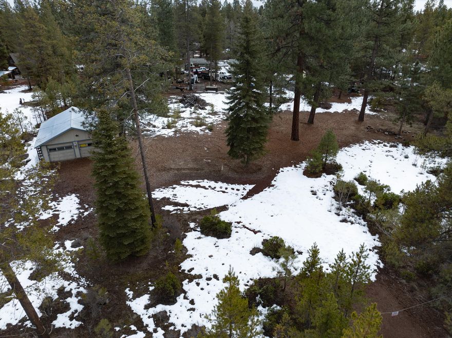 Peaceful Paradise! Close to BLM and the Little Deschutes River! This .96acre lot has it all! Build your own dream home, cabin, or get away. Flat, buildable, and already has a 720sqft garage/shop. Electricity to the property and well and septic installed, buyer to do own due diligence. Private and treed, bring your imagination to this lot.